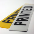 Load image into Gallery viewer, Two license plates with 'PRINTED' text on a white background